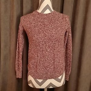 Red high neck sweater.